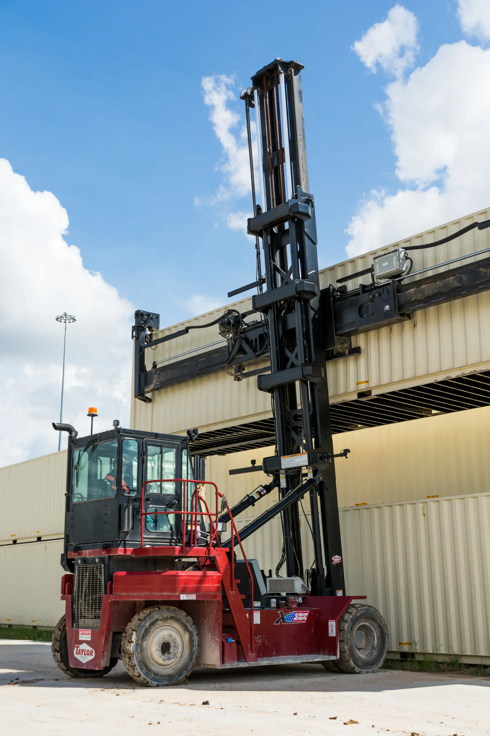 Taylor empty container handler moving empties for repositioning