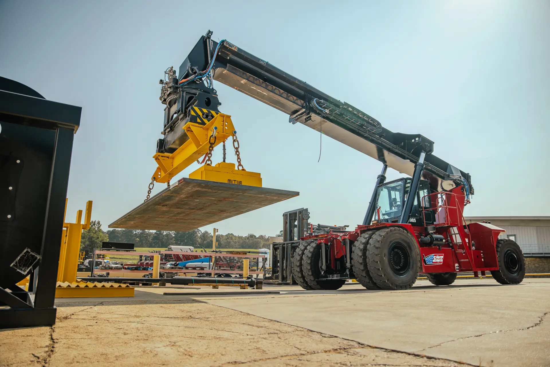 Taylor reachstacker equipped for steel slab and ferrous material handling