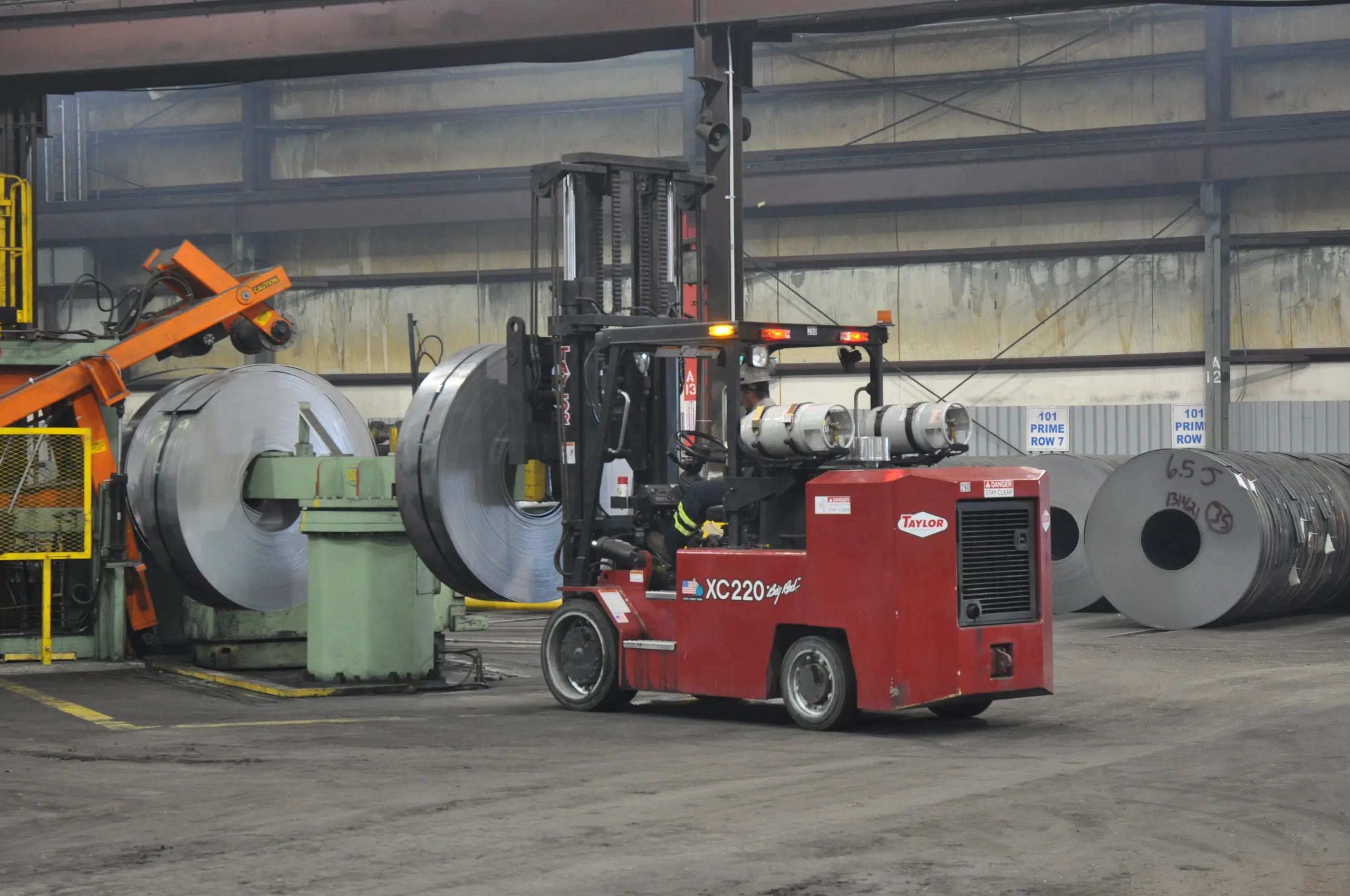 Taylor cushion tire forklift equipped for indoor steel and coil handling